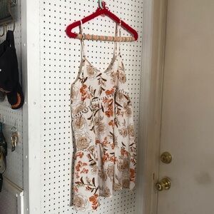 Loose fitting spaghetti strap dress.